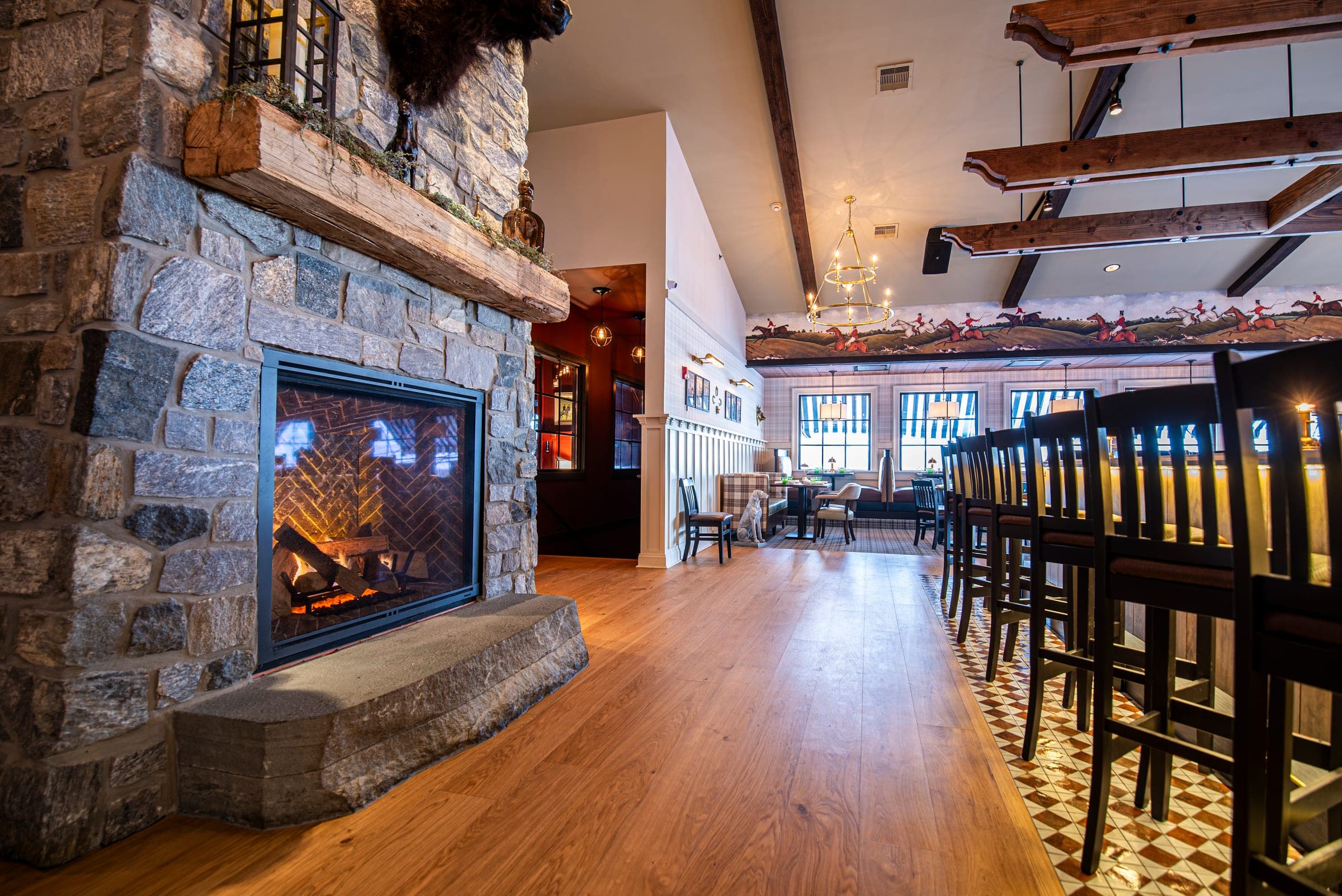 Fireside seats at the bar at The Jockey Tavern in Malvern, PA