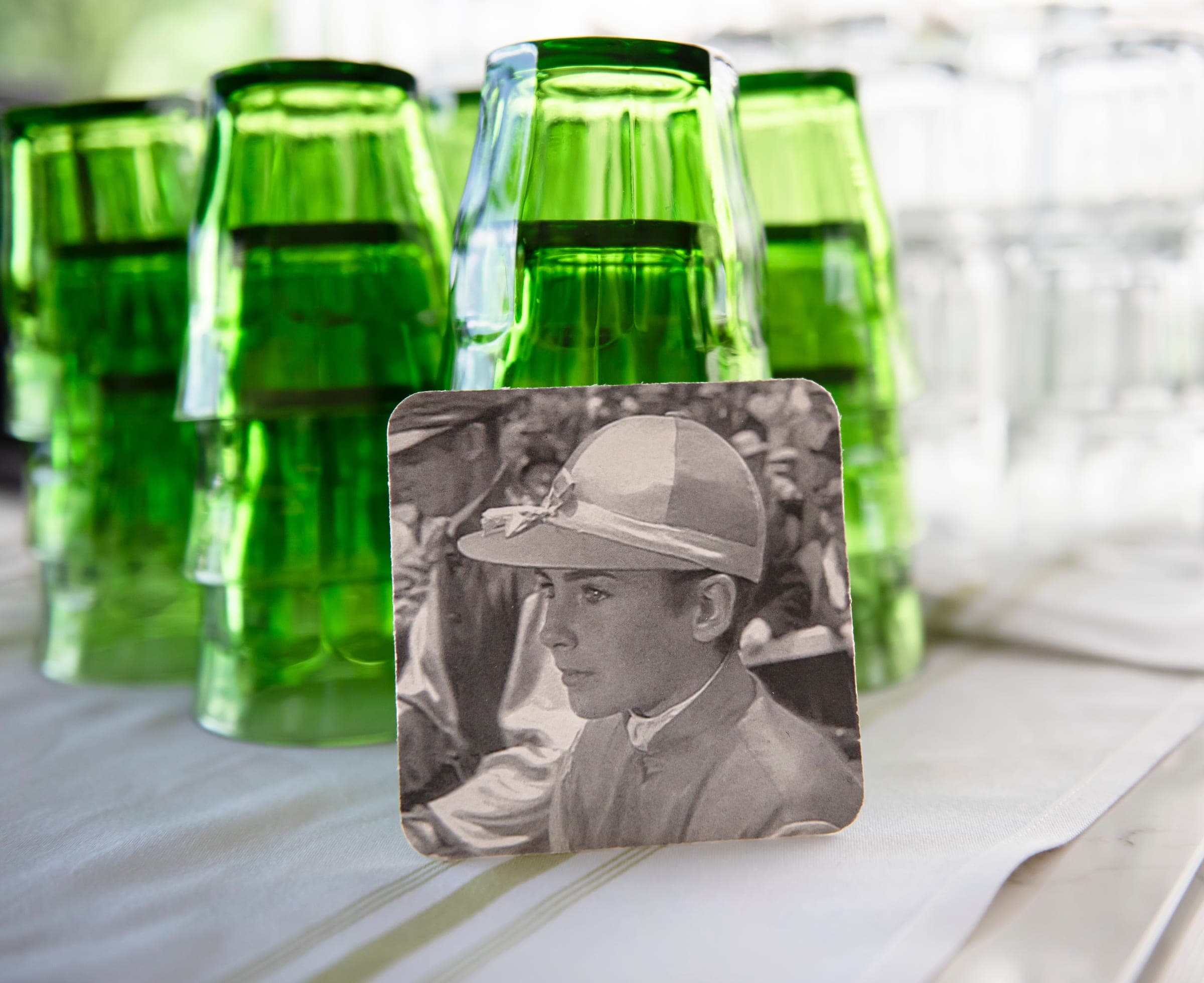 The Jockey coaster and green glassware on a table at The Jockey Tavern, Malvern, PA