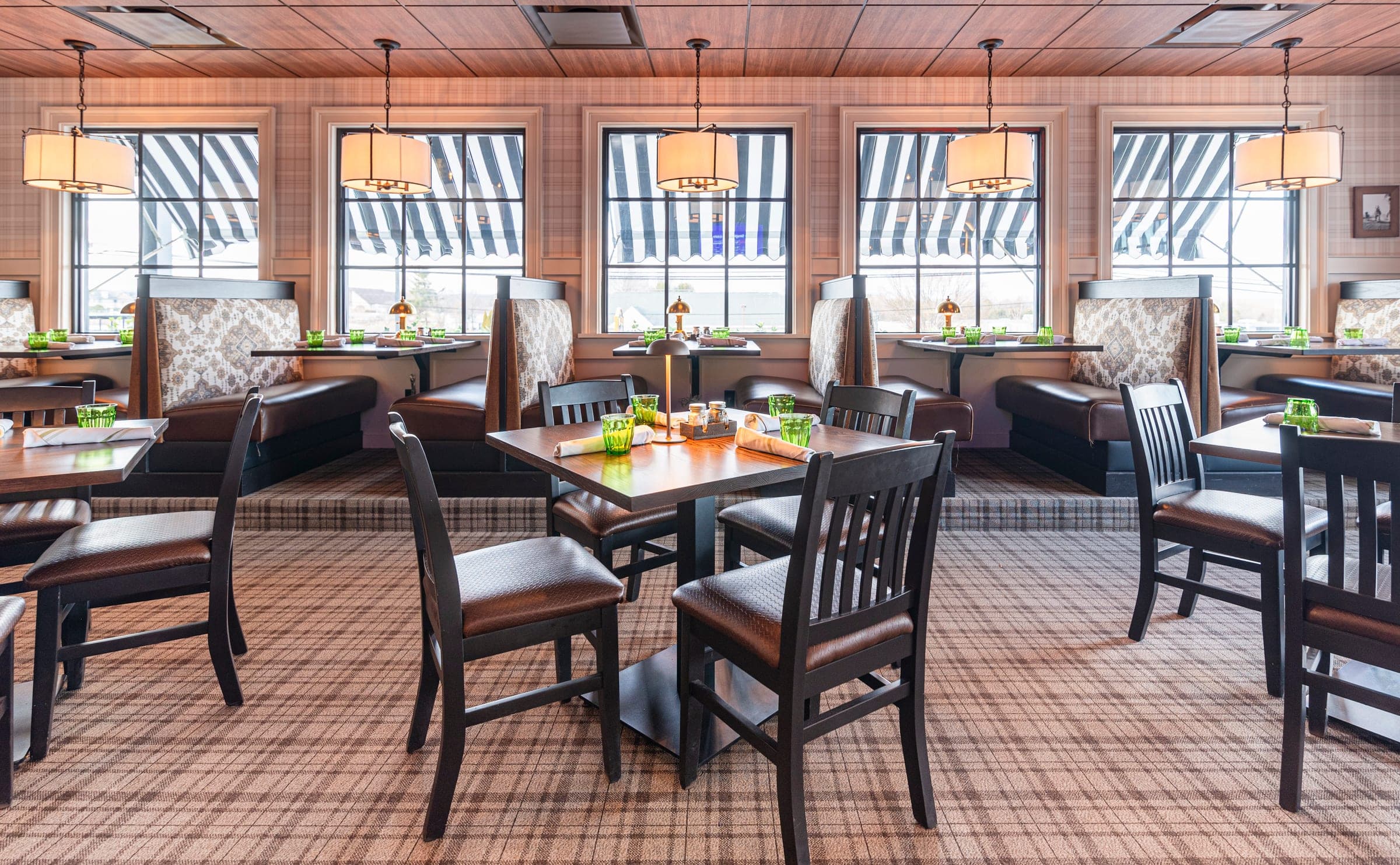 The plaid dining room set for dinner at The Jockey Tavern, Malvern, PA